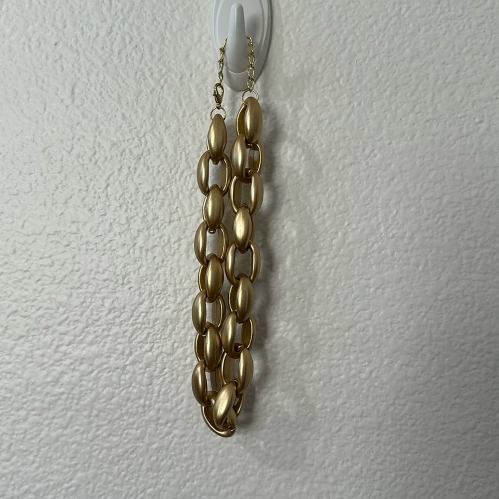 Chunky plastic gold color necklace.